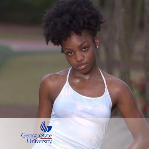 Gabrielle Henry, wearing a white top with a tree in the background, and the Georgia State University logo in the bottom left corner.