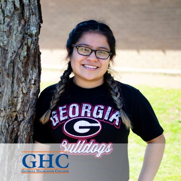Jennifer Gonzalez, a smiling student leaning against a tree, with the Georgia Highlands College logo in the bottom left corner.