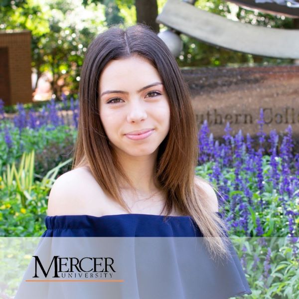Jillian Rodriguez, in a headshot in an outdoor setting, with the Mercer University logo in the bottom left corner.