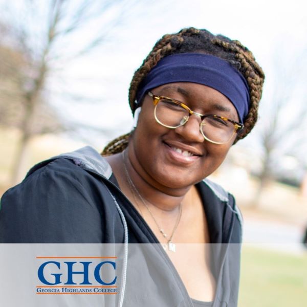 Maria Johnson, smiling in an outdoor setting.