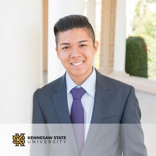 Phillip Lounmala, in a professional headshot with the Kennesaw State University logo in the bottom left corner.
