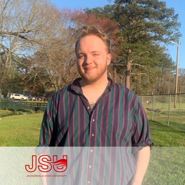 Remington Carter, smiling in an outdoor setting.