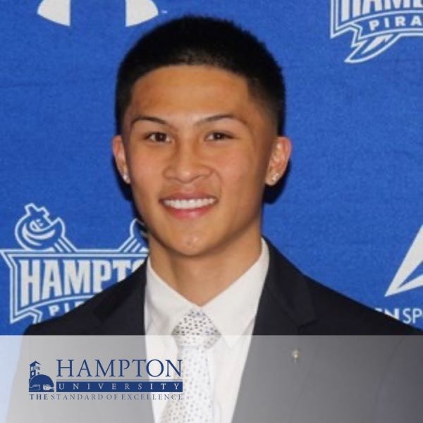 Stefan Manuel, smiling in a headshot, with the Hampton University logo in the bottom left corner.