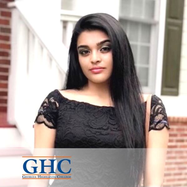 Sheena Patel, in a headshot wearing a black top with the Georgia Highlands College logo in the bottom left corner.