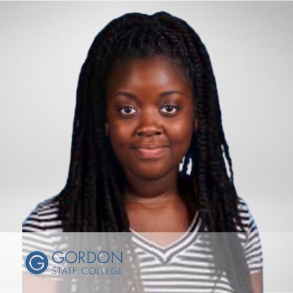 Thelangie Pierre in a headshot in a neutral background, with the Gordon State College logo in the bottom left corner.