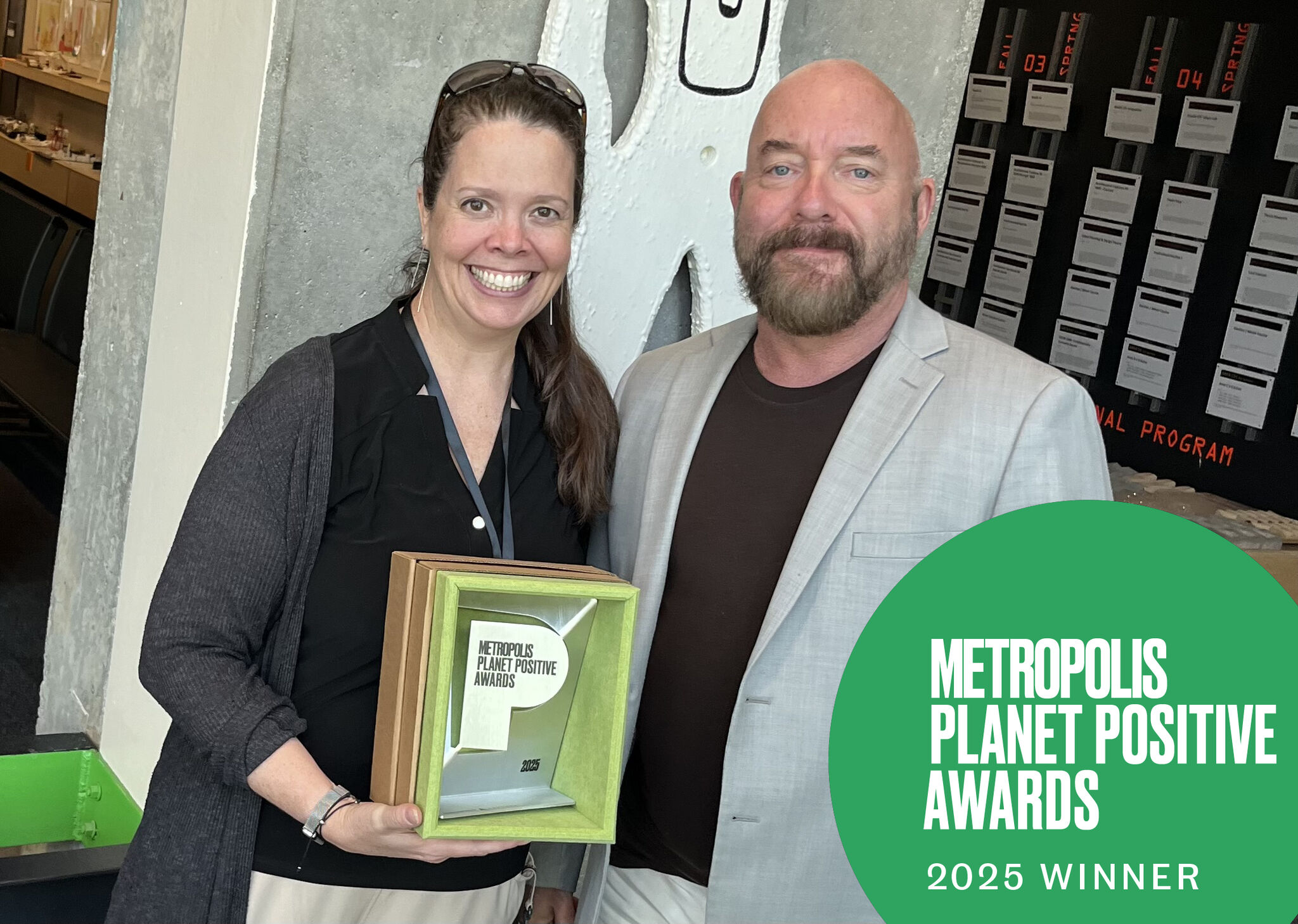 Professor Michael Carroll presents the Metropolis Planet Positive Award to a smiling Professor Robin Puttock.