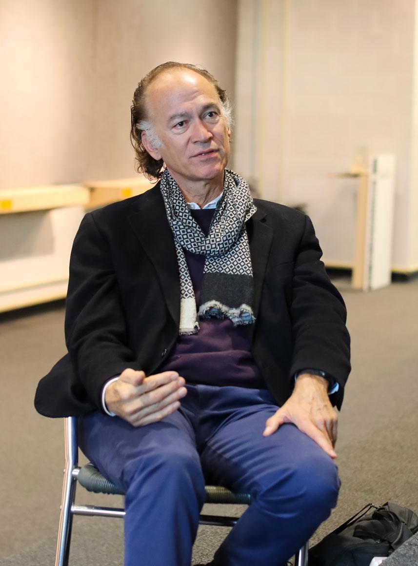  / Turan Duda sitting in chair 