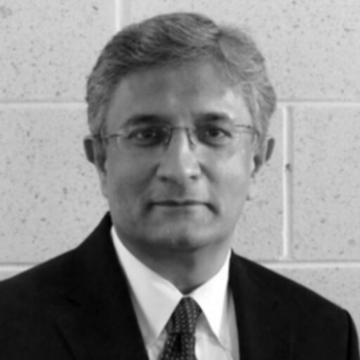 Ameen Farooq headshot in black and white. 