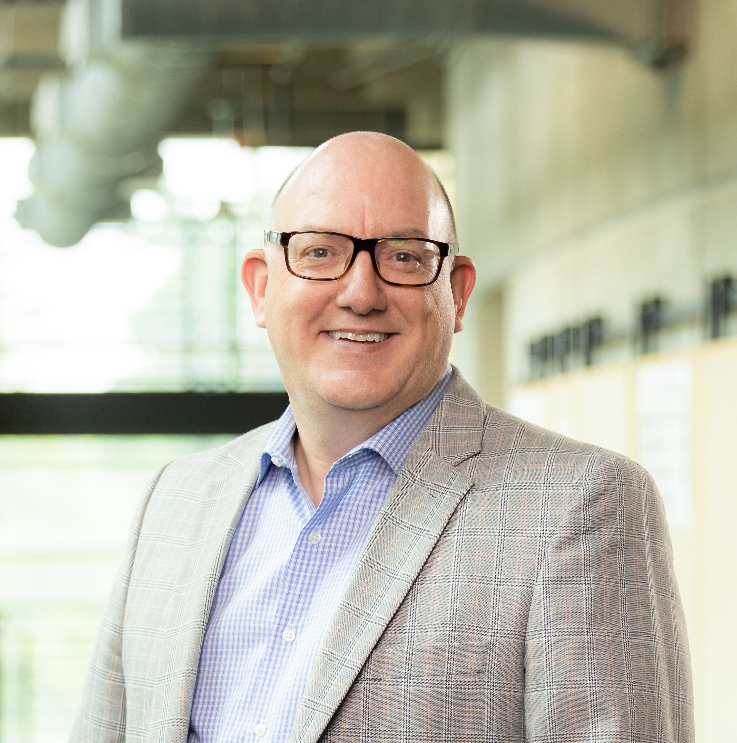 Andrew Payne smiling in the Architecture lobby.