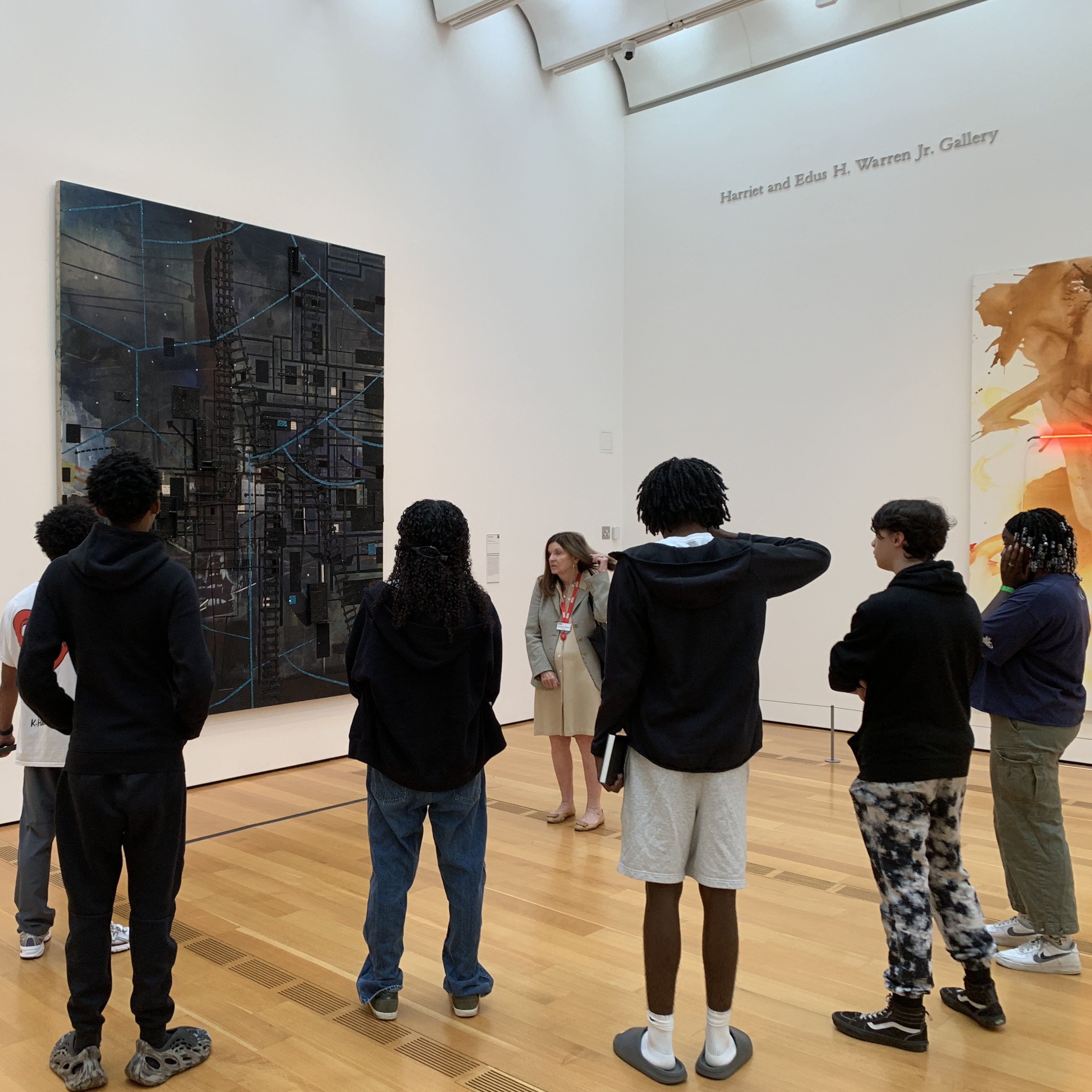 Students observe modern art in one of the gallery spaces at the High Museum of art.