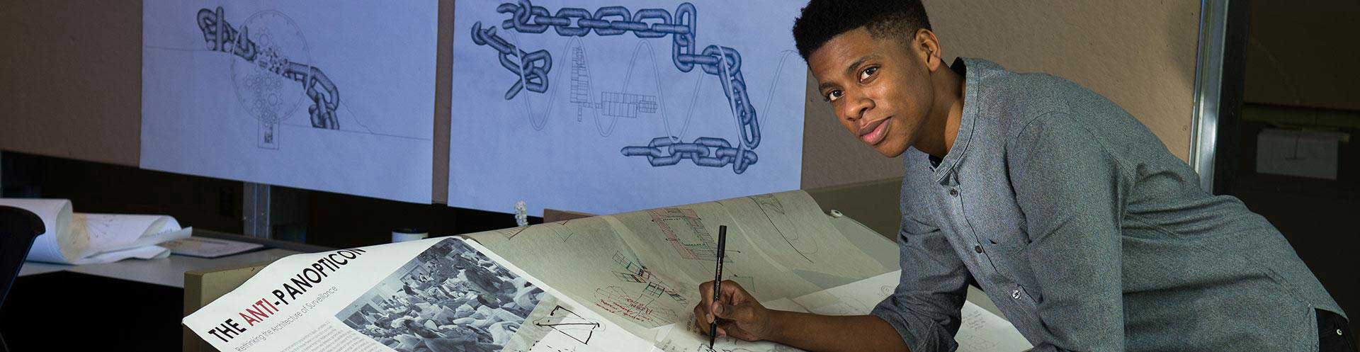 ksu architecture student working at drafting table