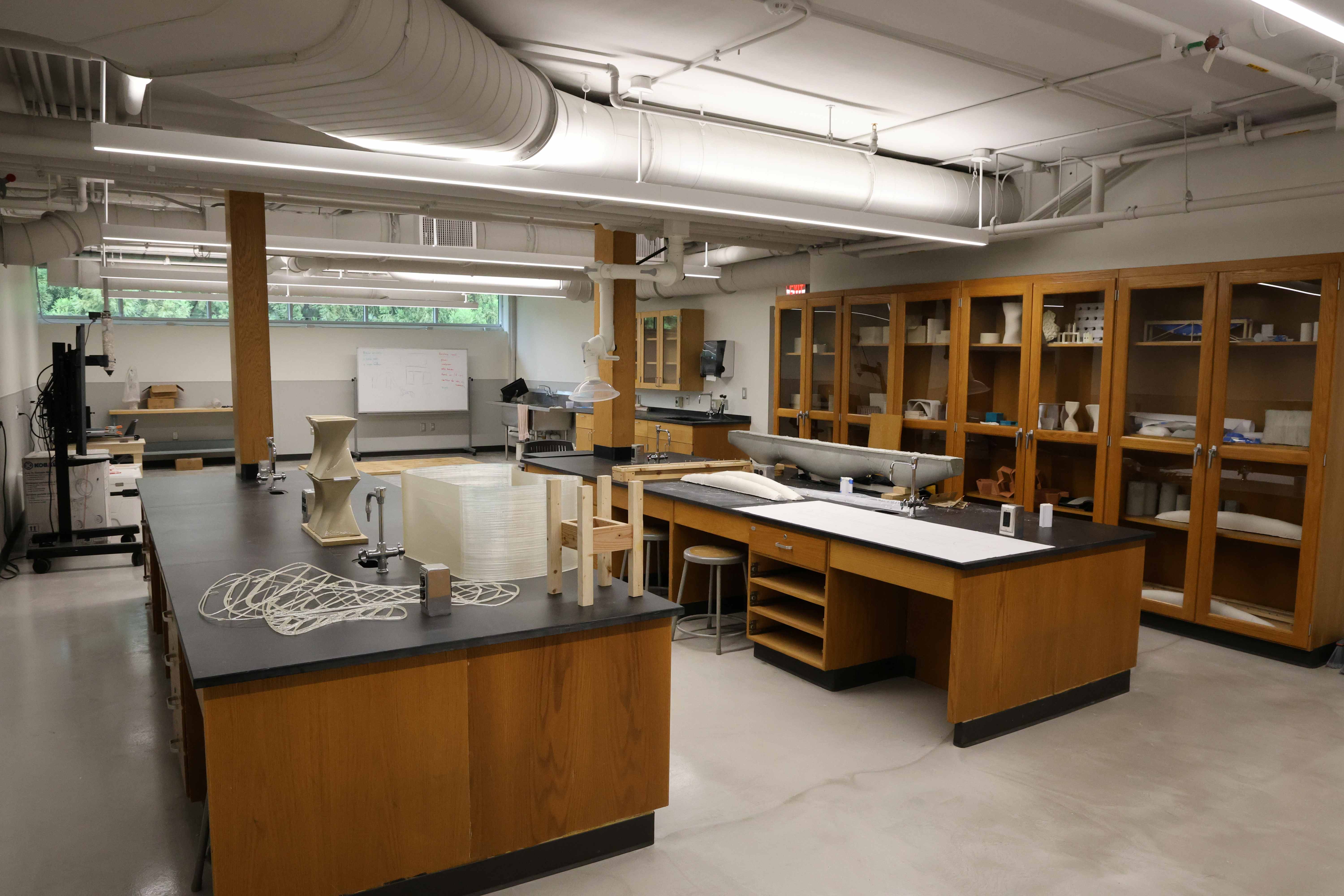 Lab tables with various materials and models on them.