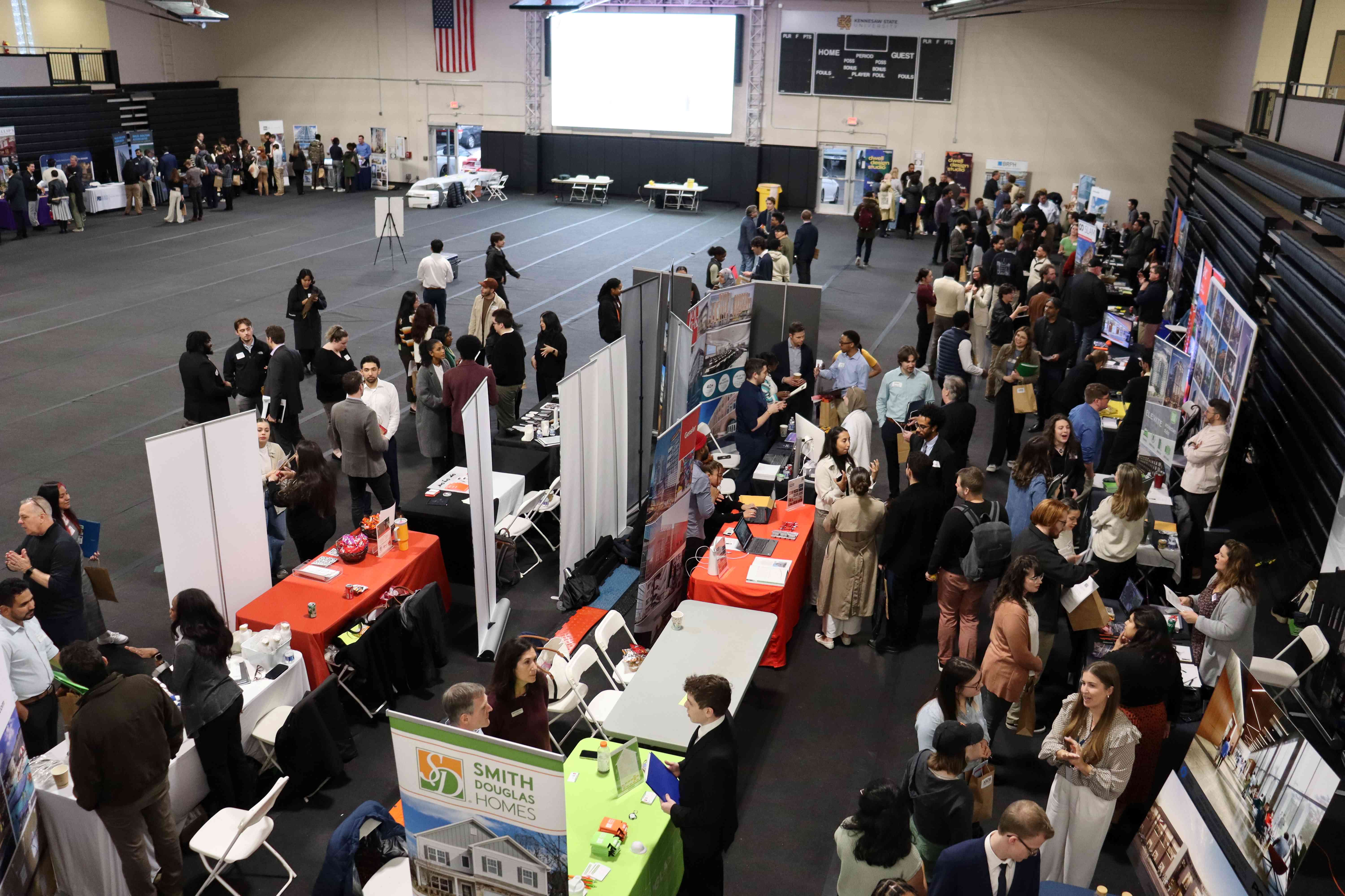 A birds-eye-view of the Marietta Events center where students visit various tables during the Career Fair.