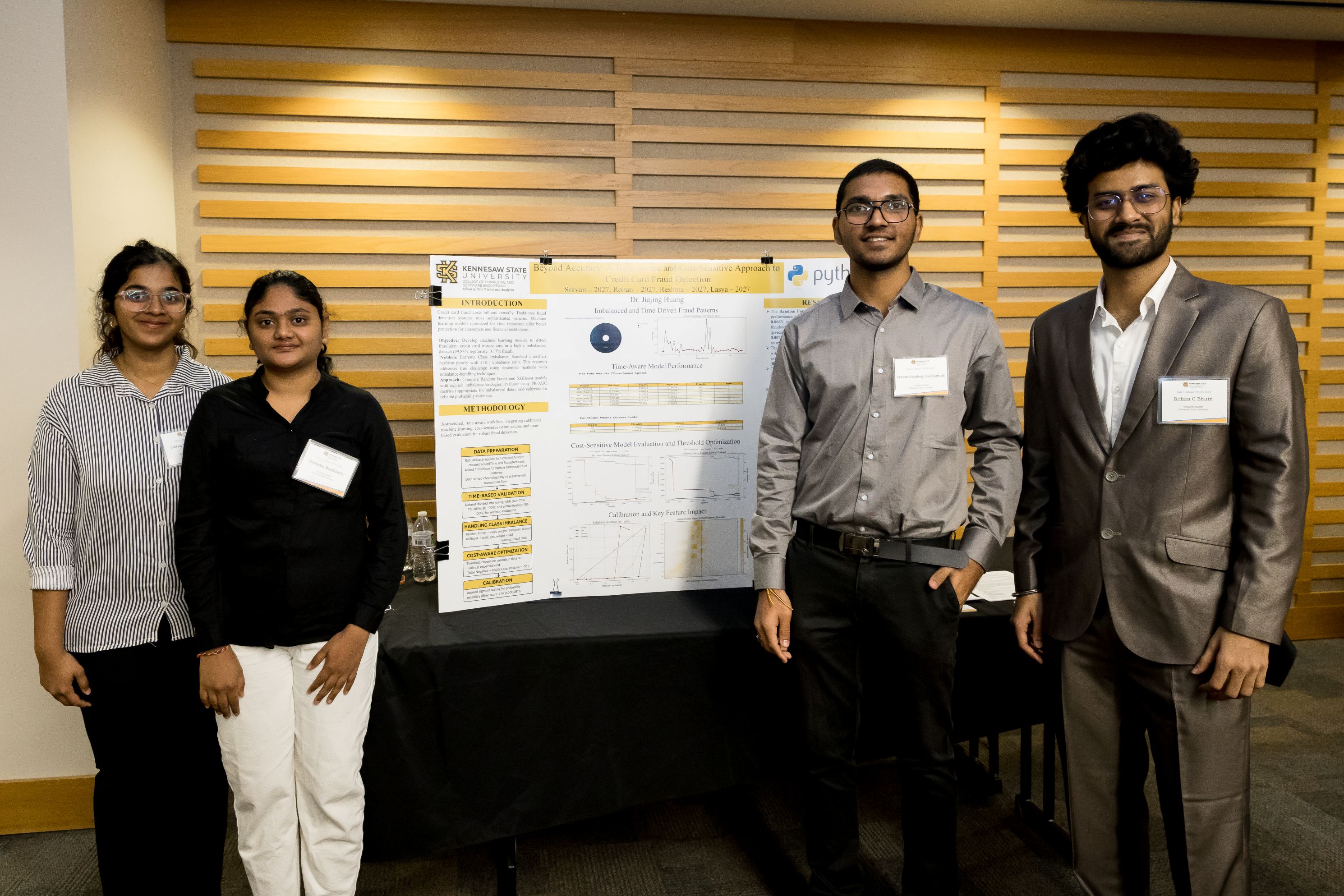 Students standing in front of their poster 