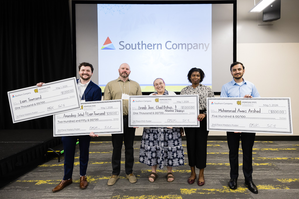 Spring 26 Analytics Day Winners smile at camera