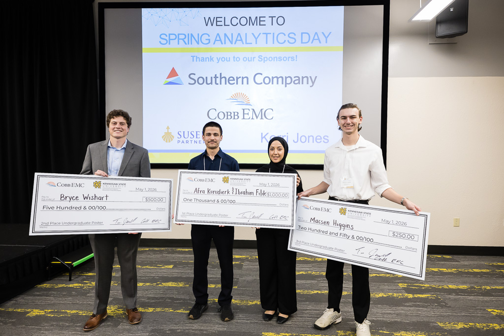 Spring 26 Analytics Day Winners smiling with checks 