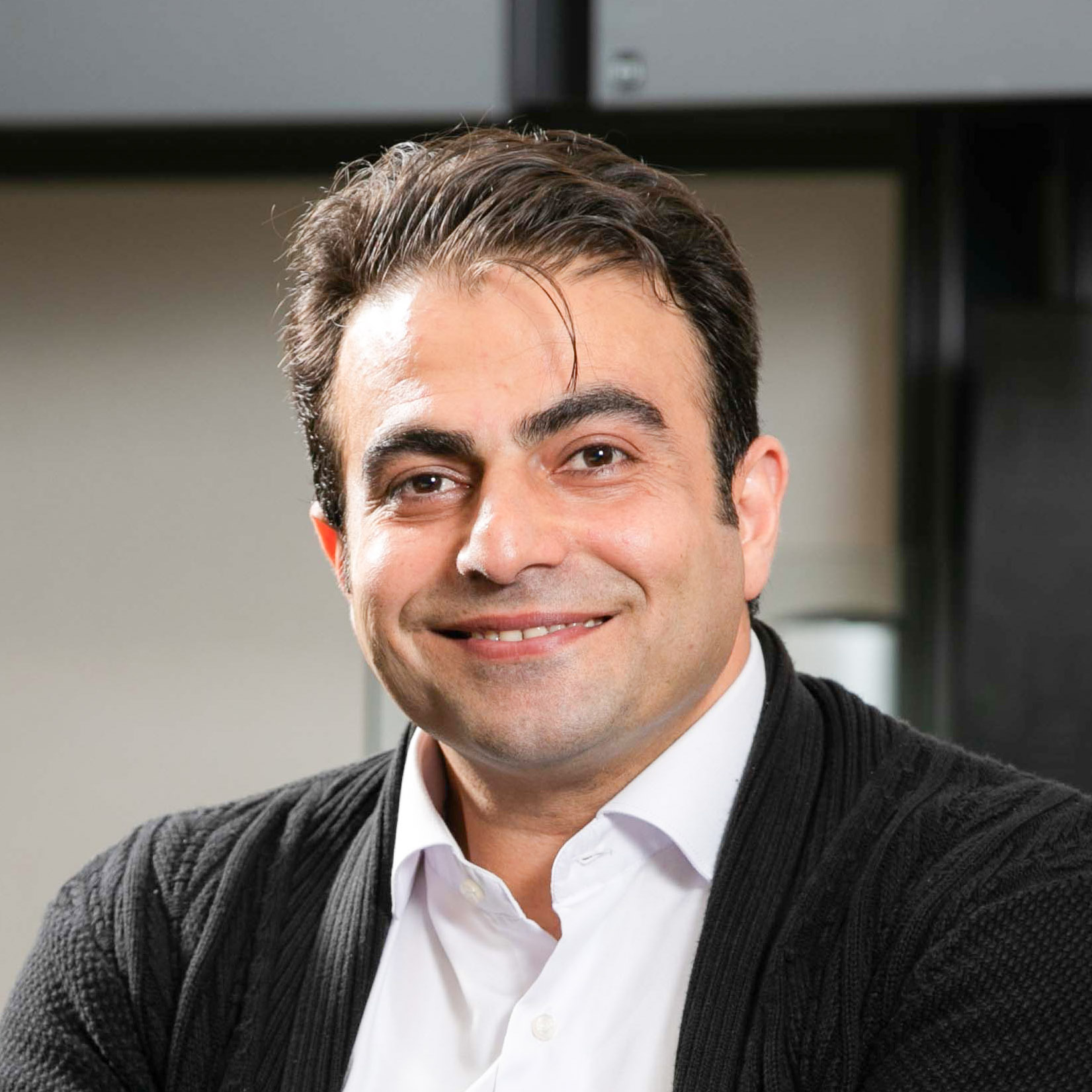 Reza Parizi smiles.