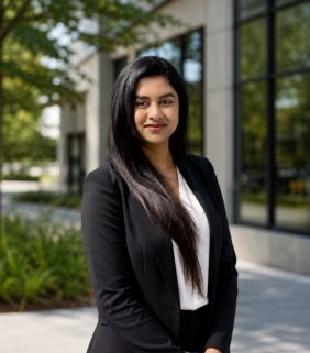 woman with long in in black suit with white shirt