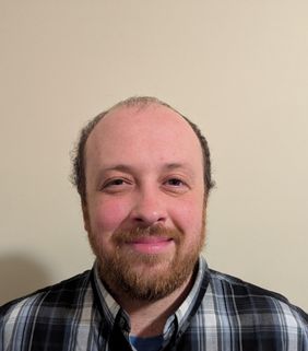 man with blue and white shirt