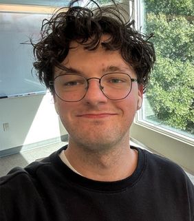 man smiling with glasses