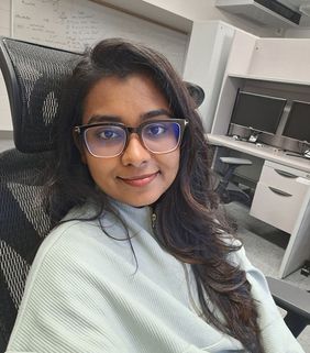 woman in green shirt in chair