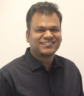smiling man in black shirt