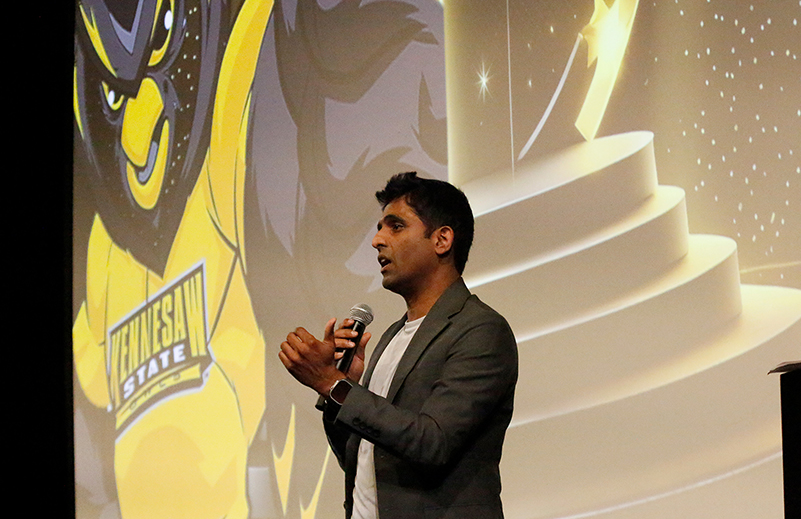 Rajesh Indurthi of Charter Global speaks with students during the awards presentation for the Spring Hackathon for Social Good 2025.
