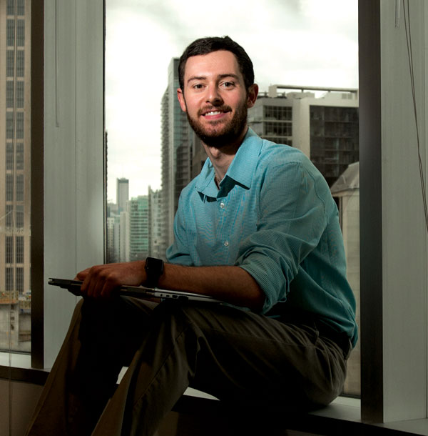 ksu ccse student sitting on window seal.