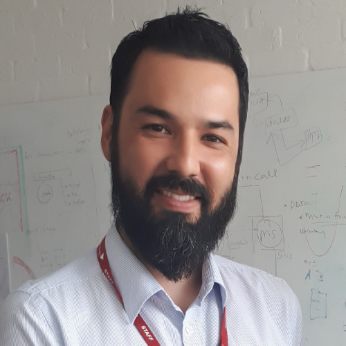 SWE Advisory Board member Hugo Watanuki smiles.