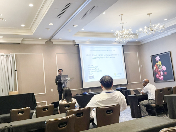 KSU CCSE student giving presentation in meeting room