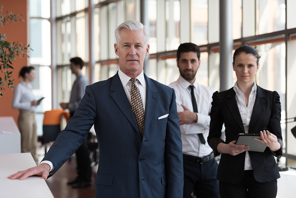 three people in a formal business setting