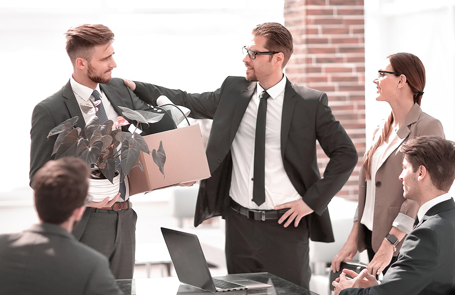 a group of business professionals say goodbye to a college. 