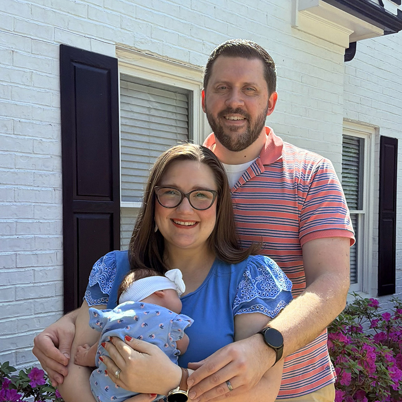 Director Sara E. Davis with her husband Garrett and daughter
