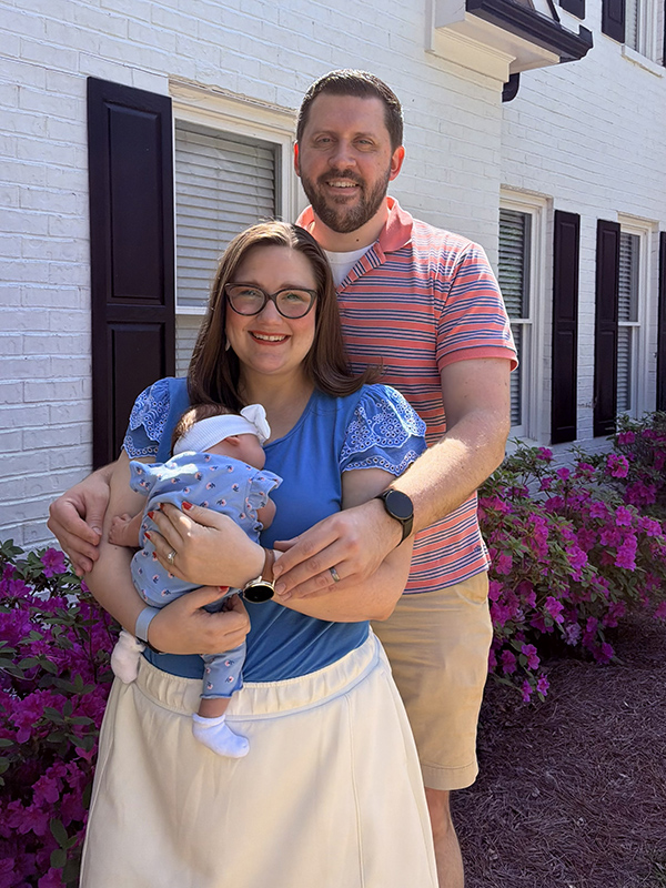 Director Sara E. Davis with her husband Garrett and daughter.