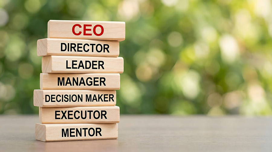 a stack of wooden blocks with the titles of different roles in a hierarchy