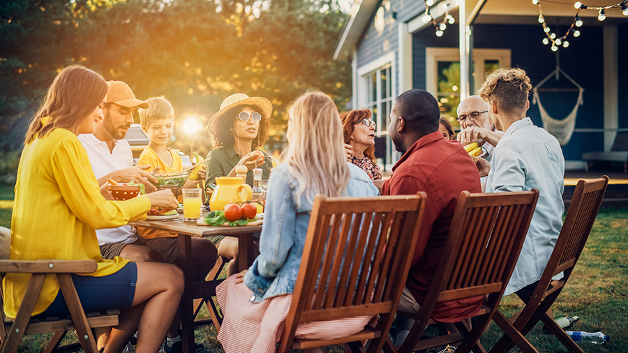 a family sharing a meal in an outdoor setting