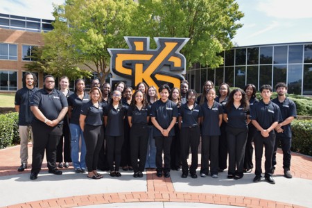 students outside standing in front of the ksu sign