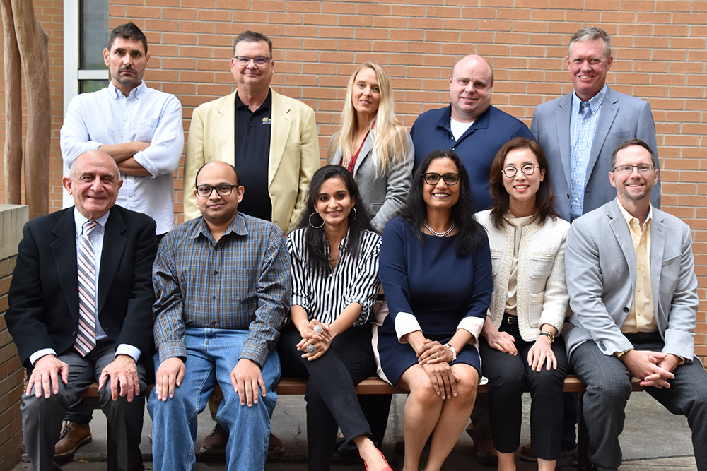 photo of ksu phd marketing professors standing together outside