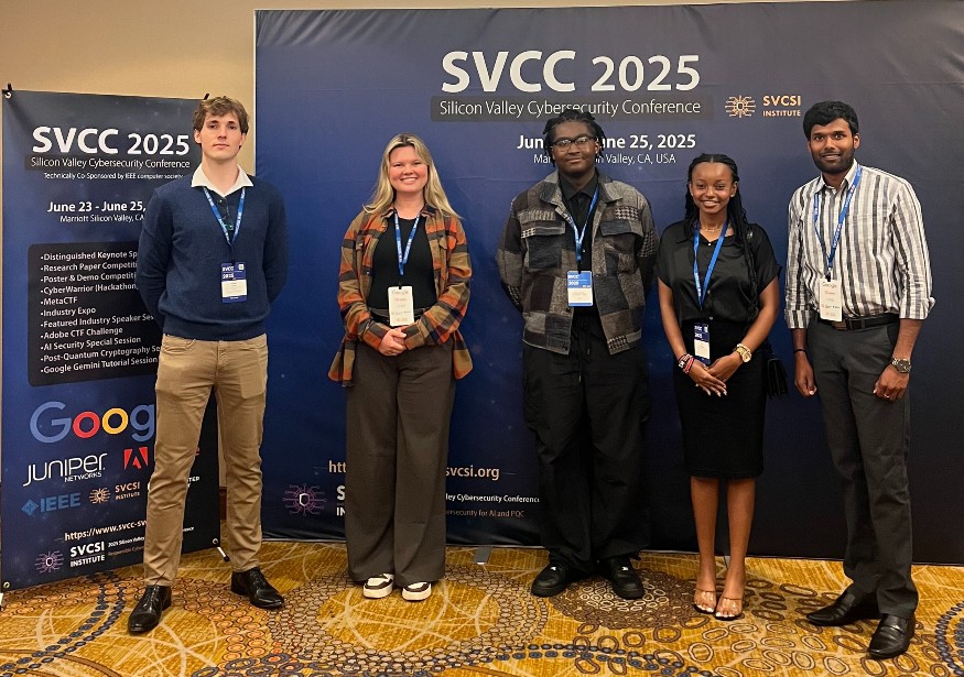 photo of Maxwell Bradley, Cassidie Grogan, Christopher Forrester-Jack, Lisa Thiongo, Manohar Raavi at the cybersecurity conference