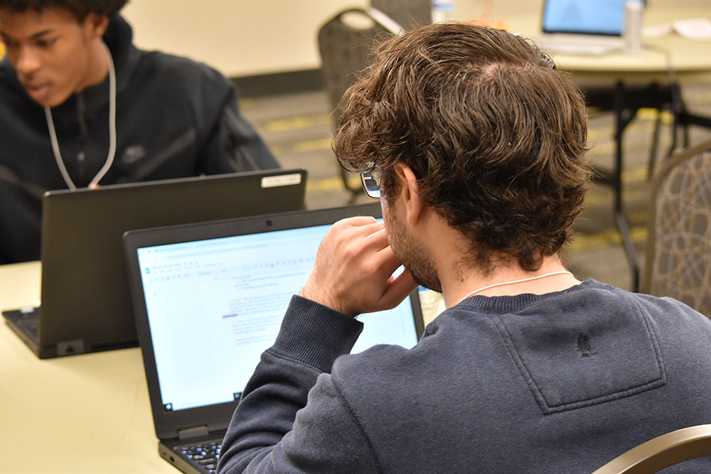 Student participant in the hackathon working on his wellness app