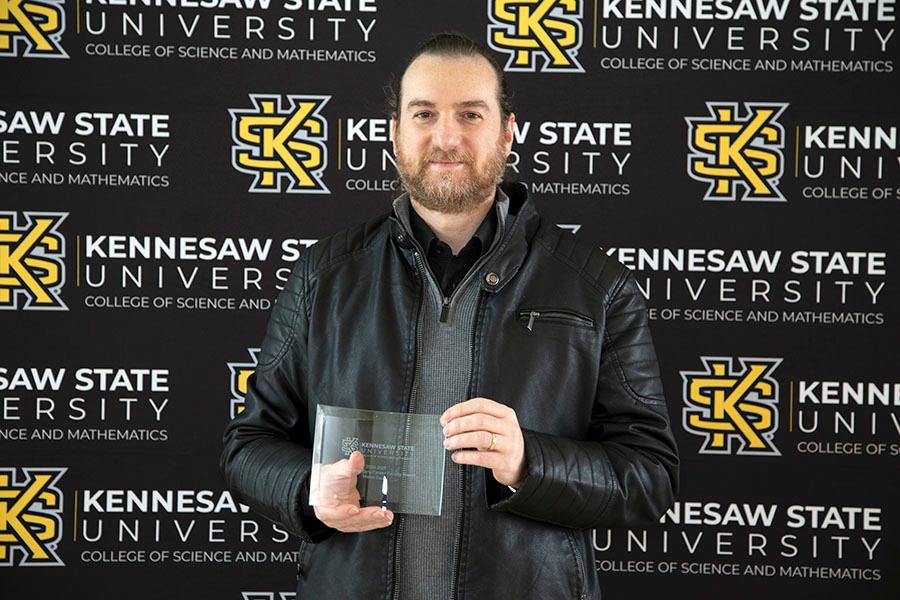  / Outstanding Early Career Faculty Award - Dr. Marco Guzzi, Assistant Professor of Theoretical Particle Physics 