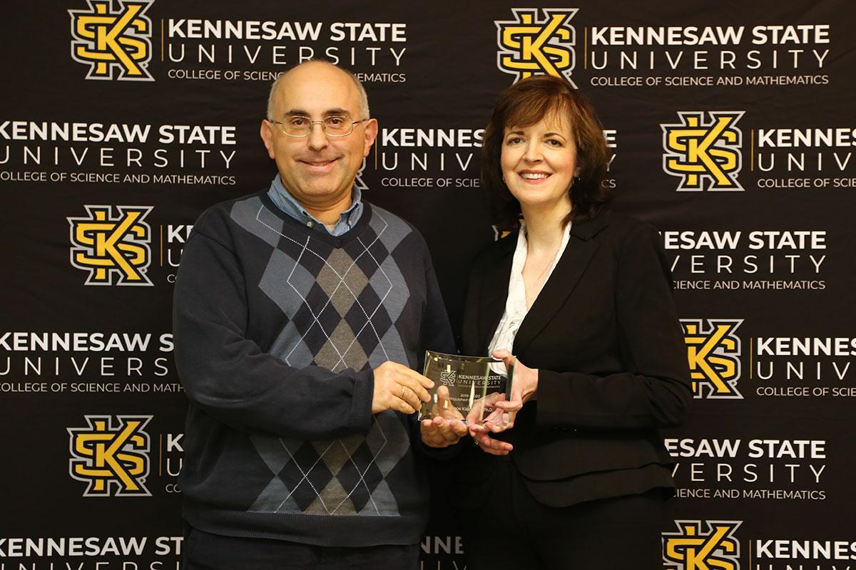  / Photo of the Distinguished Professor Award winner, Dr. Nikolaos Kidonakis, Professor of Physics, (left) and Dr. Marla Bell, Interim Dean (right) 
