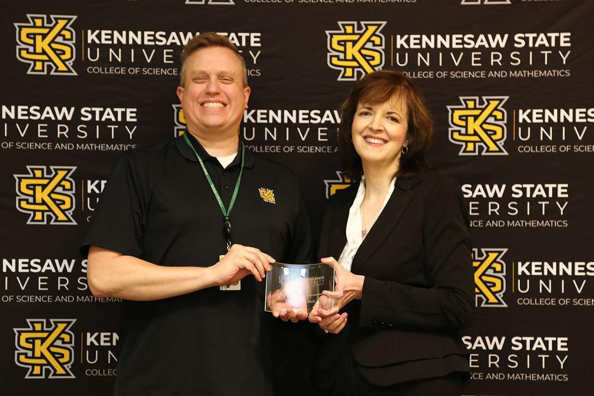  / on
Photo of the Outstanding Professional Service Award winner, Dr. Scott Nowak, Associate Professor of Biology, (left) and Dr. Marla Bell, Interim Dean (right)