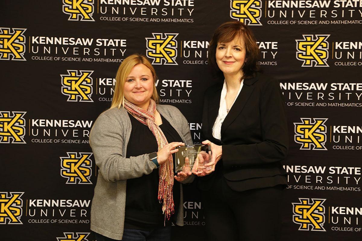  / n
Photo of the Outstanding Teaching Award winner, Dr. Jennifer Louten, Associate Professor of Biology, (left) and Dr. Marla Bell, Interim Dean (right) 