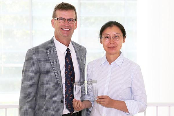  / on
Photo of Mark Anderson (left) and Distinguished Mentoring Award recipient, Sherry Ni, Ph.D., (right) Interim Chair of the Department of Statistics and Analytical Sciences and Professor of Statistics (STAT) 