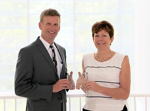  / Photo of Mark Anderson (left) and Distinguished Scholarship Award recipient, Susan Smith, Ph.D., (right) Professor of Biology, Department of Molecular and Cellular Biology. 
