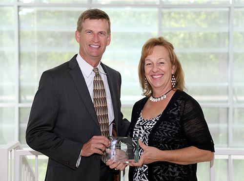  / Photo of Mark Anderson (left) and Distinguished Staff Award recipient, Laurette Rust (right), Department of Molecular and Cellular Biology. 