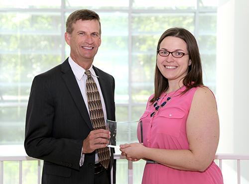 / Photo of Mark Anderson (left) and Distinguished Service Award recipient, Kimberly Cortes, Ph.D. (right), Assistant Professor of Chemistry Education, Department of Chemistry and Biochemistry. 