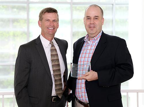  / Photo of Mark Anderson (left) and Distinguished Professor Award recipient, Jonathan McMurry, Ph.D. (right), Associate Vice President for Research and Professor of Chemistry, Department of Molecular and Cellular Biology/KSU Office of Research. 