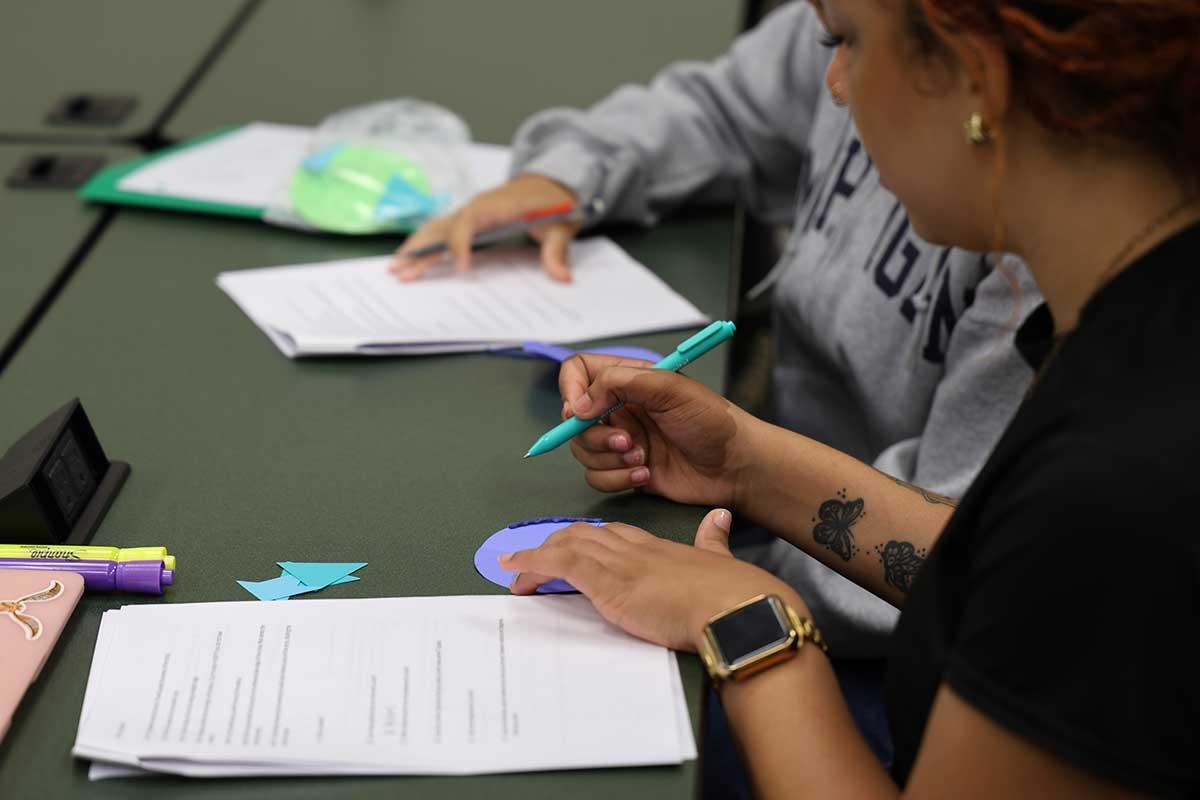 CSM PRESS program students engaged in focused work participating in a classroom activity.  / CSM PRESS program students engaged in focused work participating in a classroom activity. 